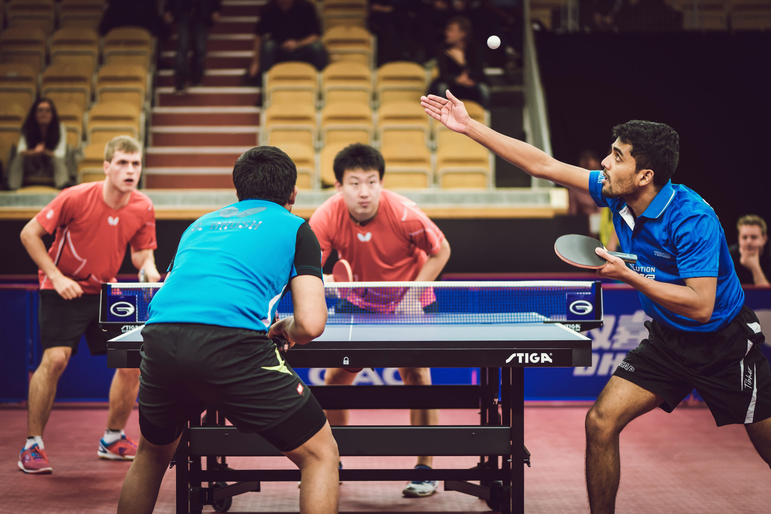 four players playing doubles